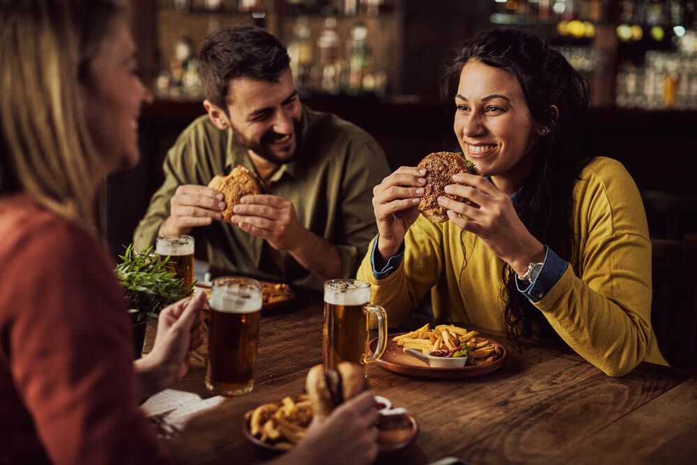 Photo of people enjoying drinks and dinner in downtown Highlands, NC