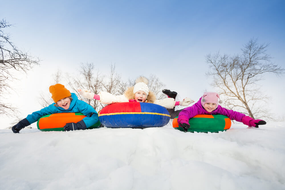 Photo of kids snow tubing in the winter: what to do in Highlands NC