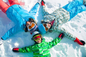 Kids laying in the snow at the Sapphire Valley Ski area