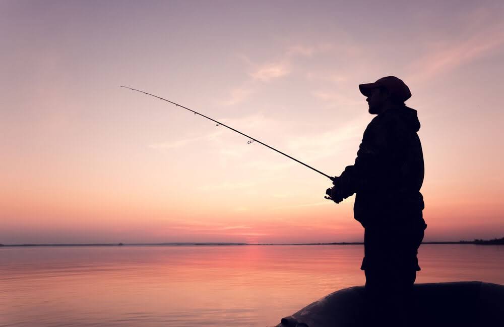 Person fishing at sunset in Highlands North Carolina
